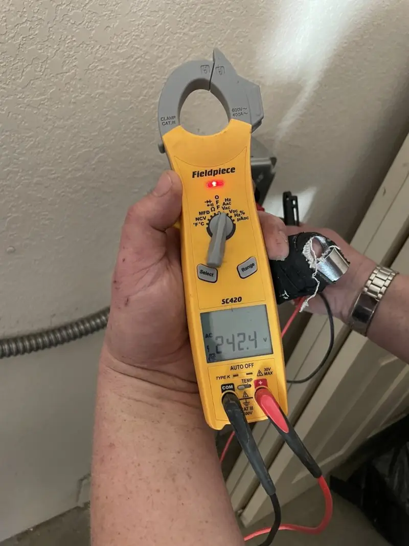 Voltage testing with clamp meter during Ceiling Fan Installation in Herrin